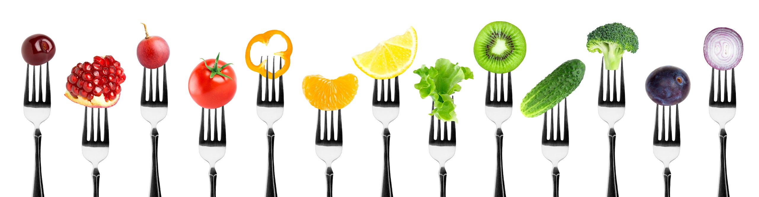 Several forks with fruit and vegetables.