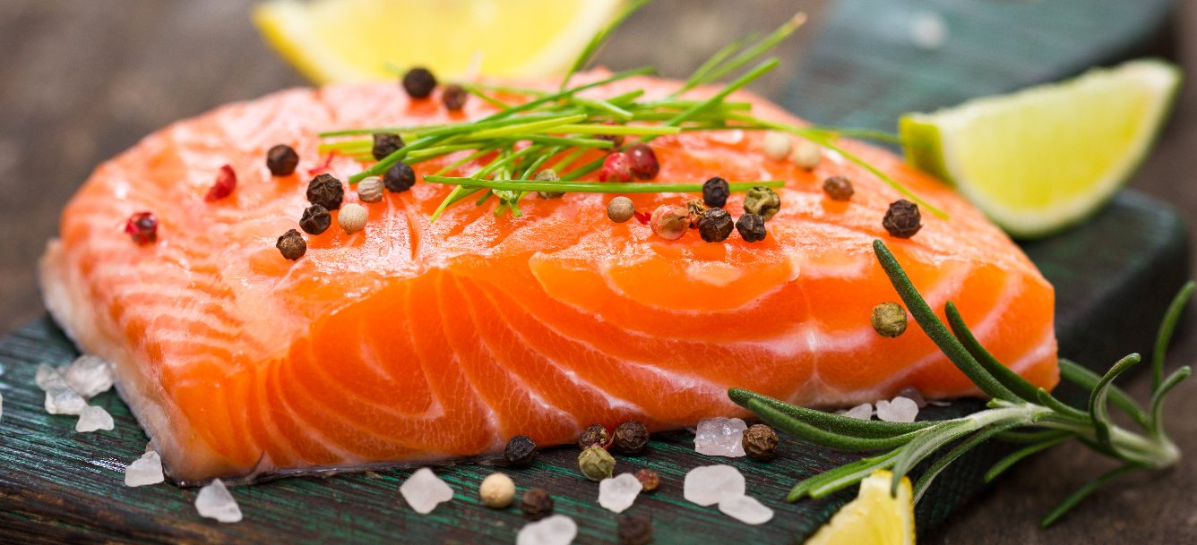 Raw salmon in a cutting board