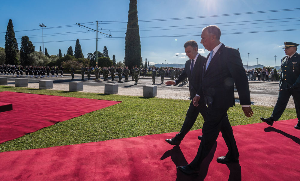 Portuguese President Marcelo Rebelo de Sousa (R) and the President of Colombia Juan Manuel Santos Calderon (L) walk together after having reviewed the Armed Forces honor formation outside Jeronimos Monastery on November 13, 2017 in Lisbon, Portugal.