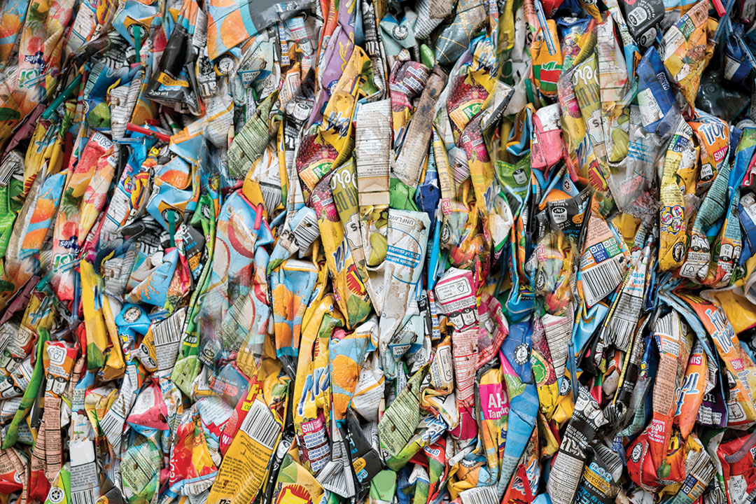 Close-up on pieces of cardboard garbage at a recycling factory - environmental concepts