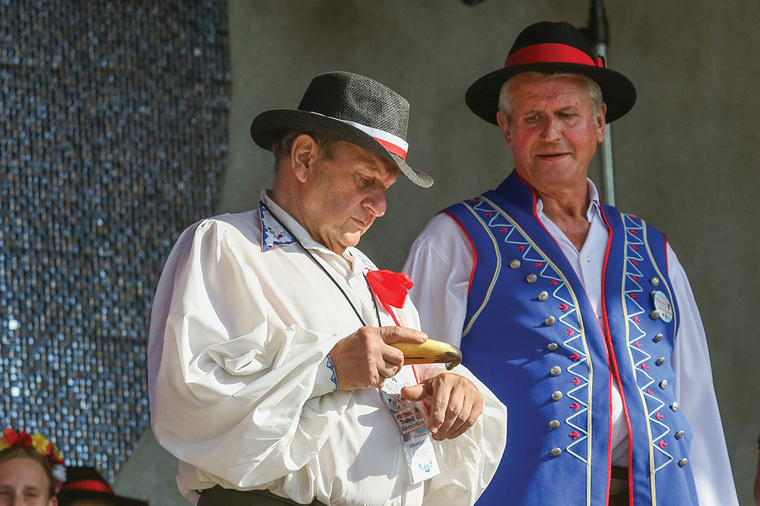 Man taking snuff from traditional Kashubian snuff box made of cow horn is seen in Chmielno, Kashubia region, Poland on 21 July 2018