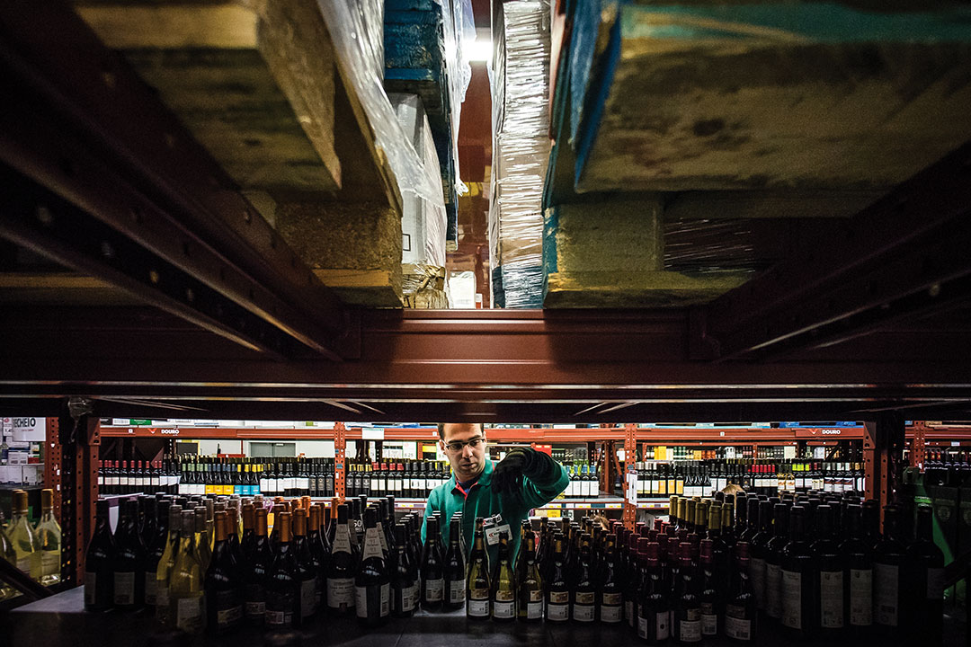 man organizing bottles