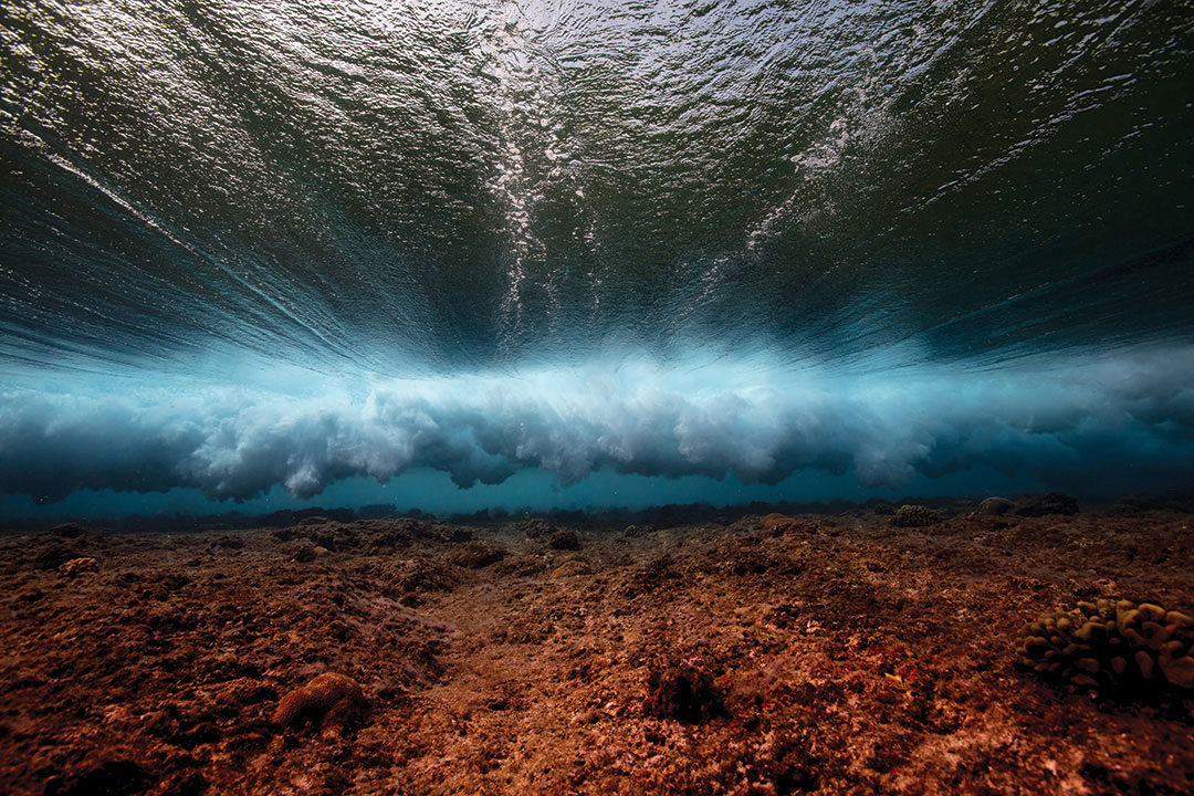 Underwater photography on location in the Indian ocean, surf adventure travel, Below the breaking waves, surf lifestyle ocean adventure.