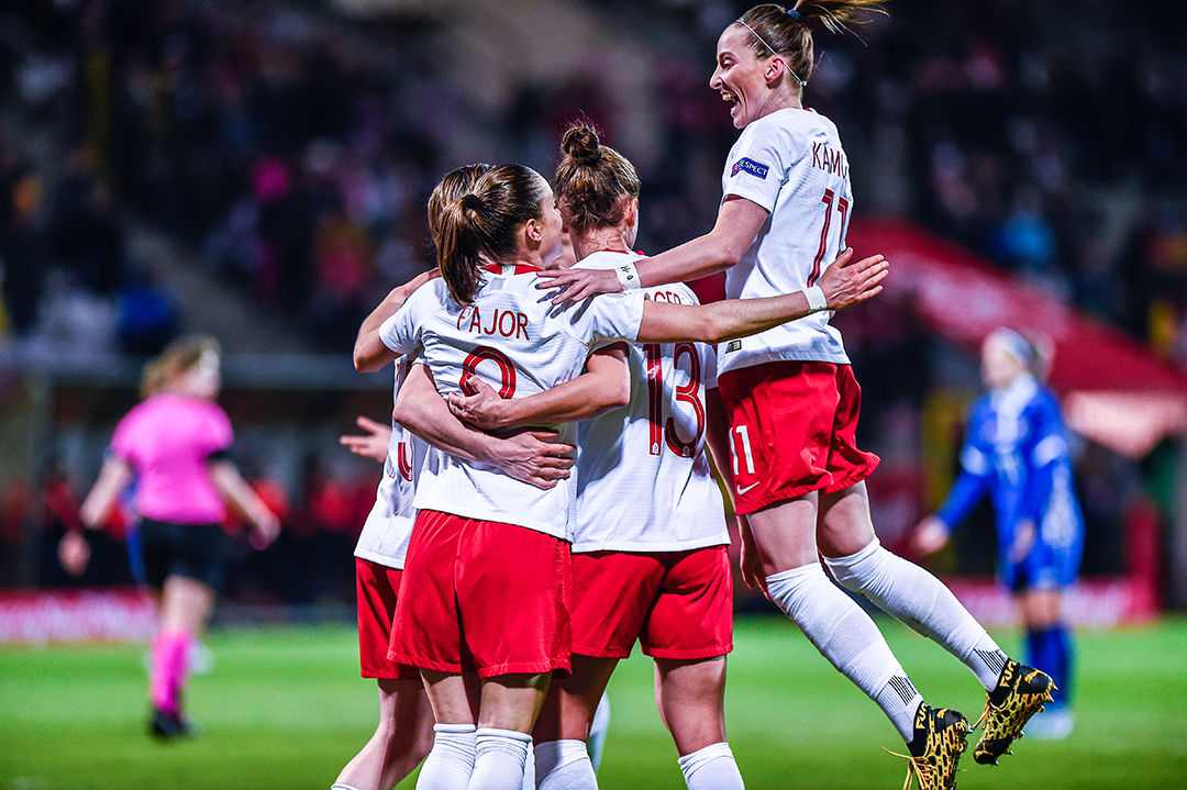 female football players jumping and celebrating