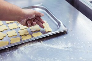 Preparing cookies to oven