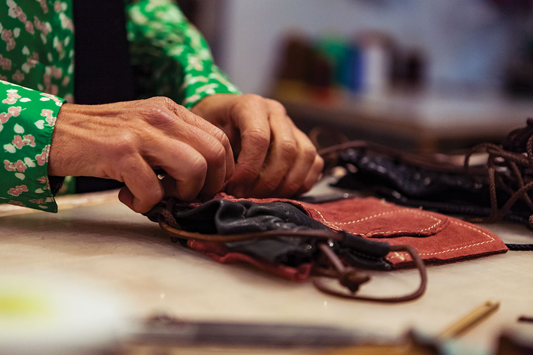 hands working on fabrics