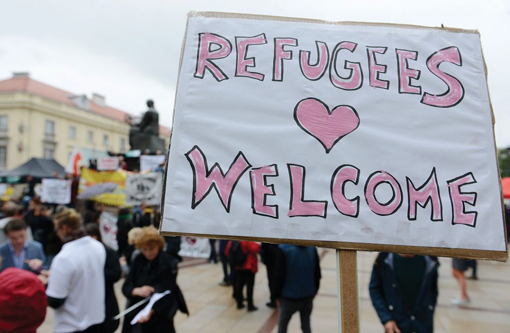 Members of Amnesty International demonstrate to support the implementation of the welcome policy towards foreign migrants from Syria and Iraq on September 12, 2015 in Gdansk, Poland.