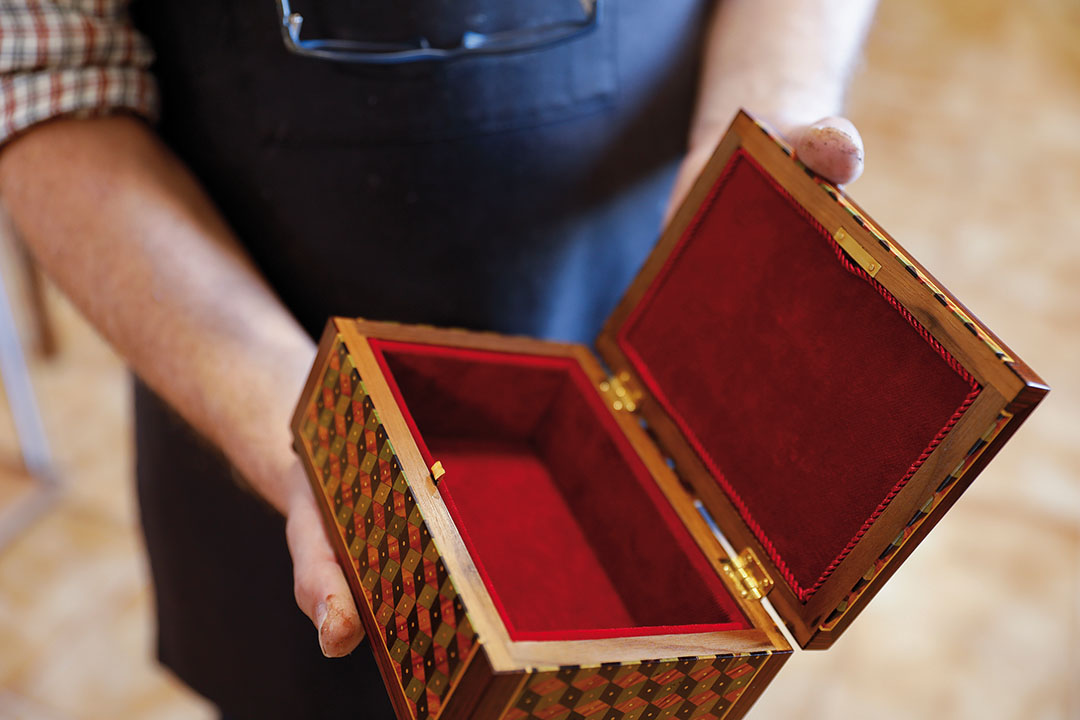 In Portuguese, these tiny compartments are called secrets, as they are made to hide precious things inside tables.