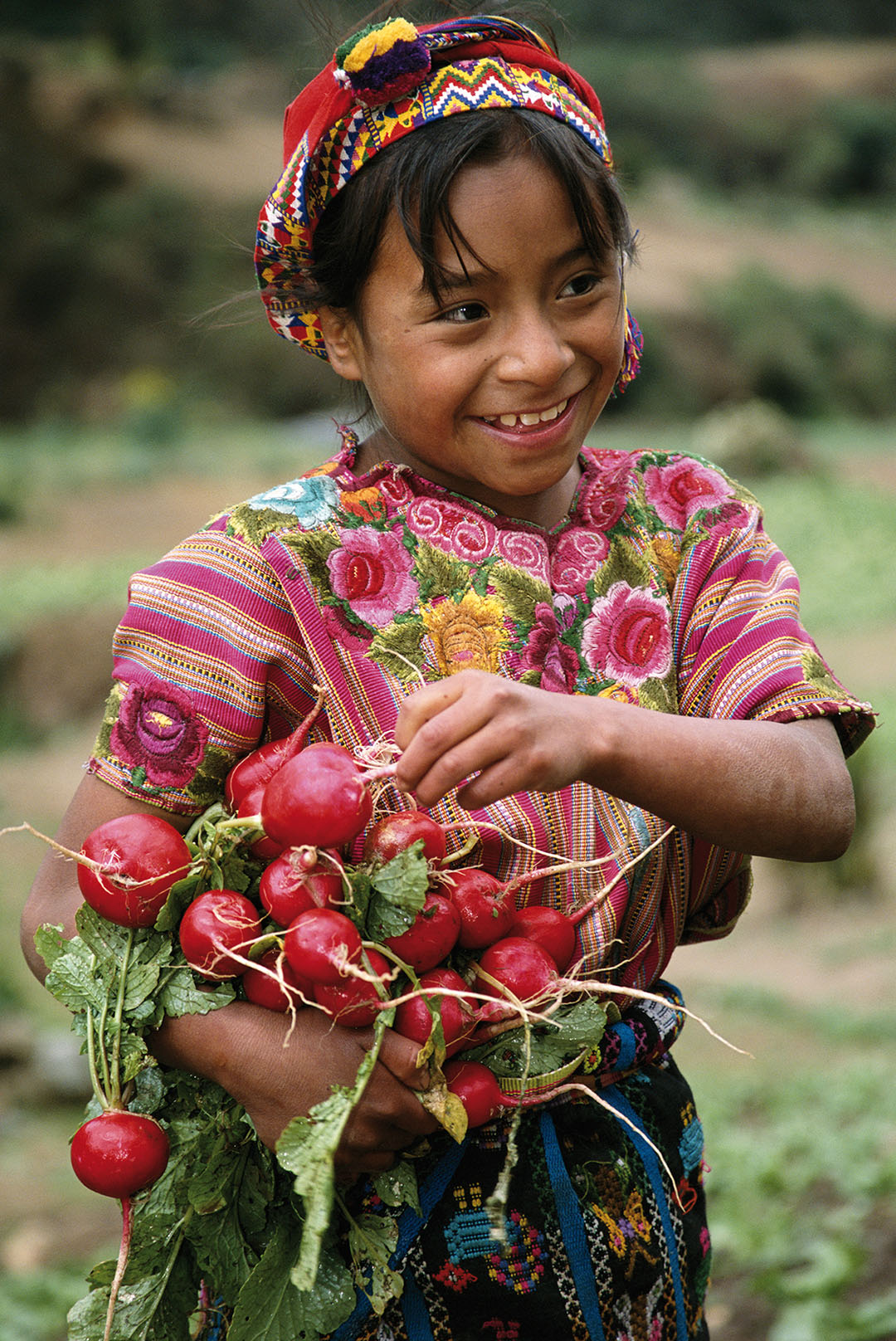 This girl is wearing a huipil, a traditional Mayan blouse, Zunil, Guatemala.