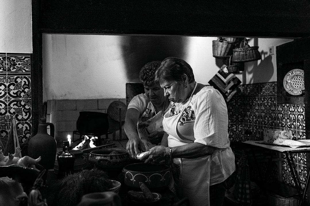 Black and white photography of Helena cooking