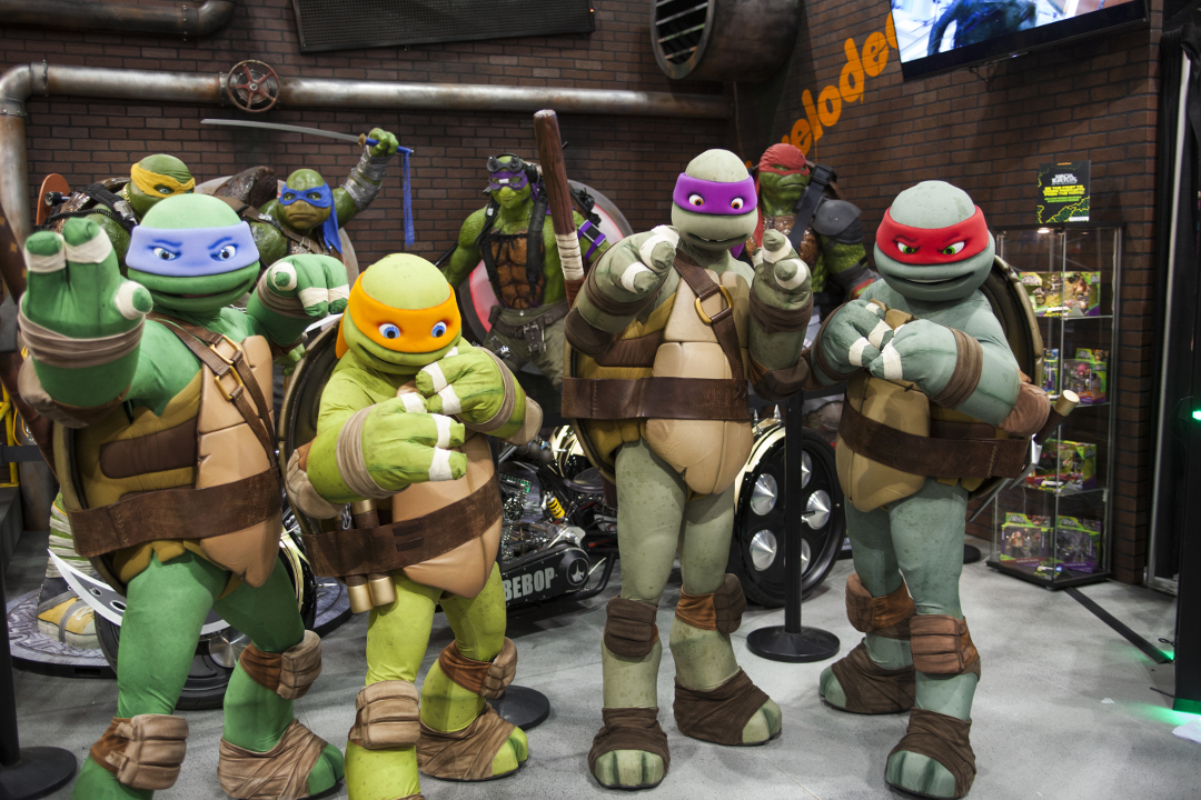 WONDERCON: Los Angeles Convention Center, March 25 thru 27, 2016. Teenage Mutant Ninja Turtles pose for a photo at their booth.