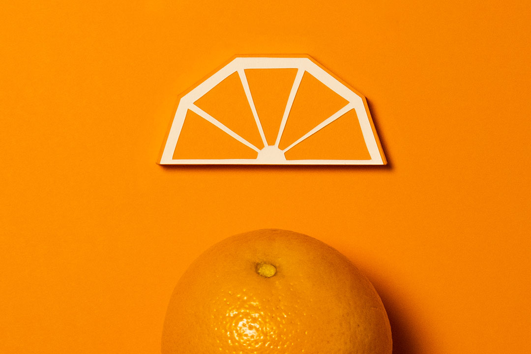 orange made of paper on a orange background