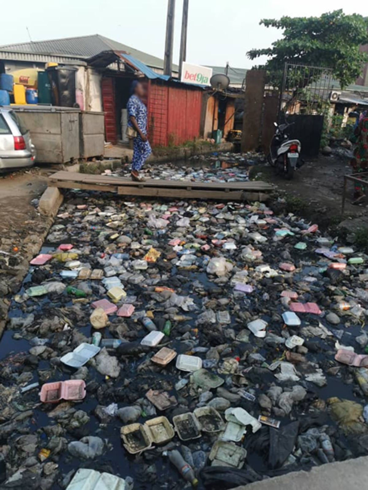 Figure 6.5 Single use plastic waste clogging open drains in Makoko, Lagos, Nigeria.