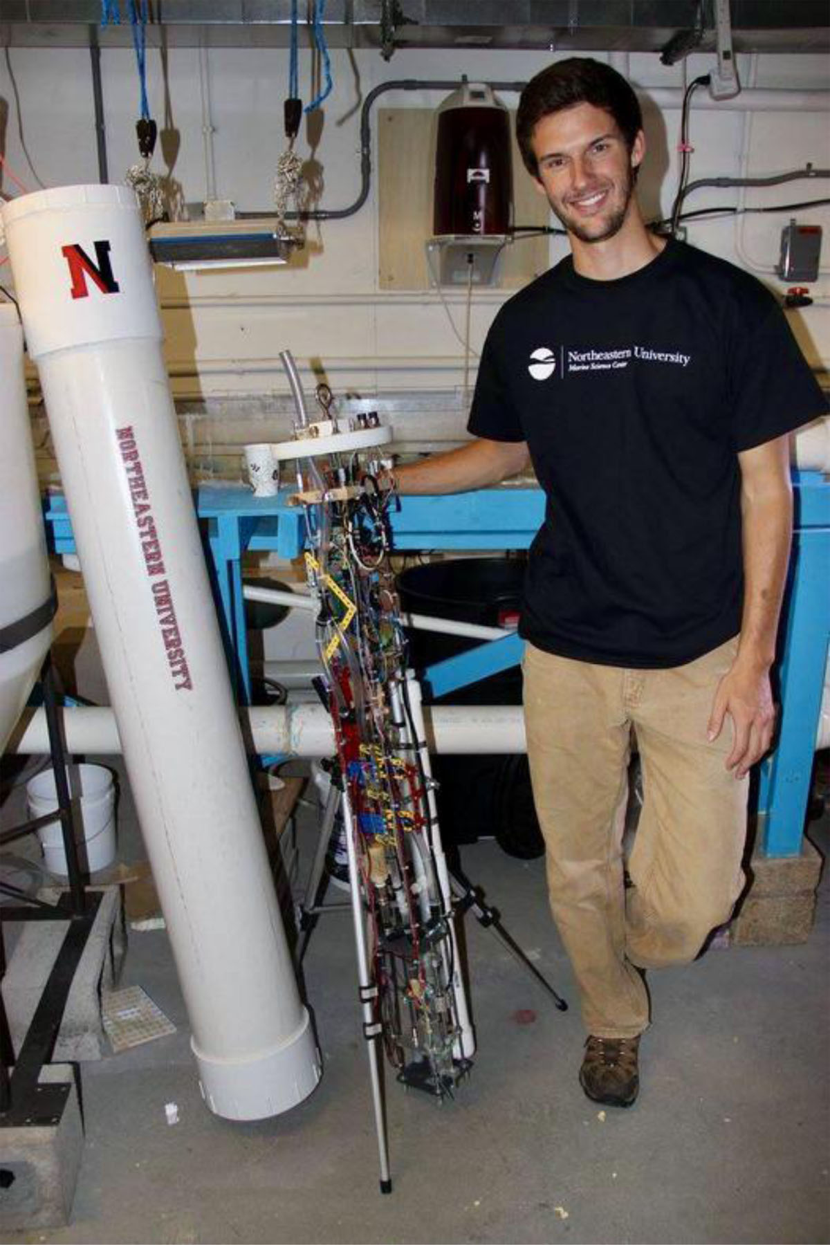 Scientist standing next to microplastics sampler