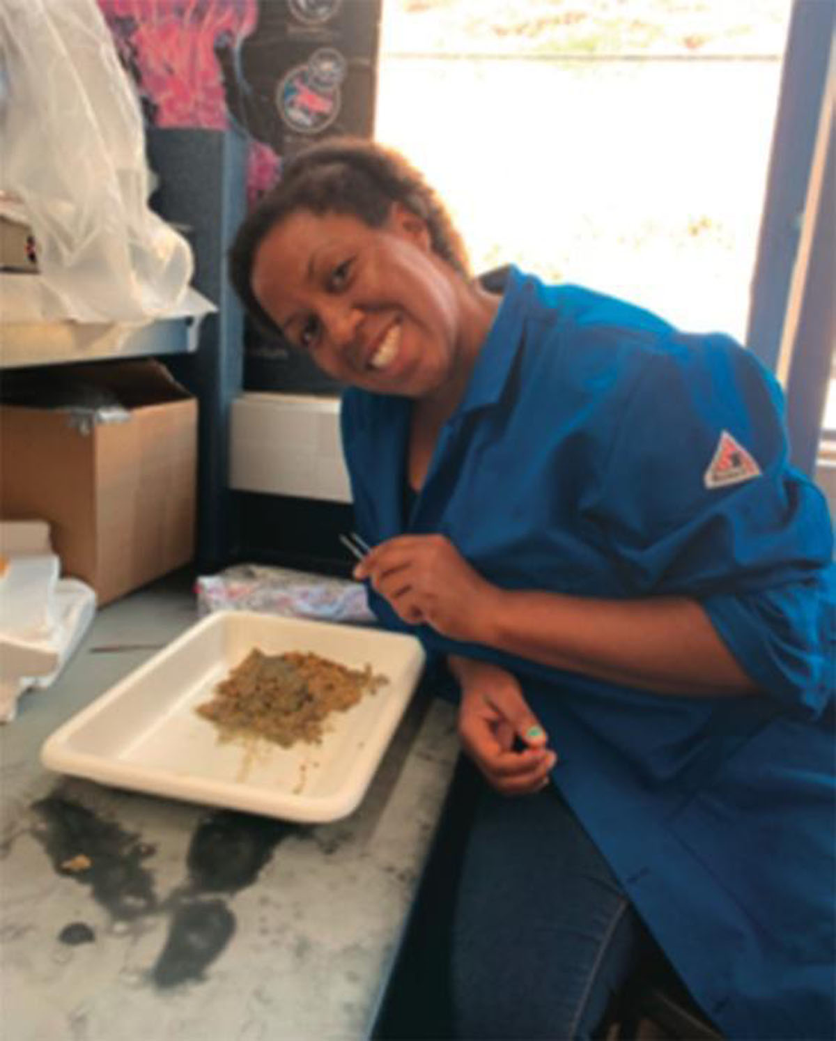 Charnelle Wickliff sorting through a rhodolith sample in the laboratory. Photo provided by Charnelle Wickliff. Permission to be reproduced