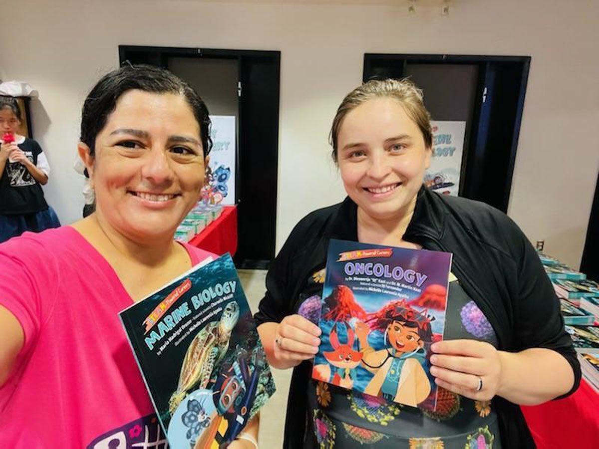Maria Madrigal with marine biology book and Dr. Dieuwertje Kast with oncology book, photo by: Maria Madrigal, permission to be reproduced