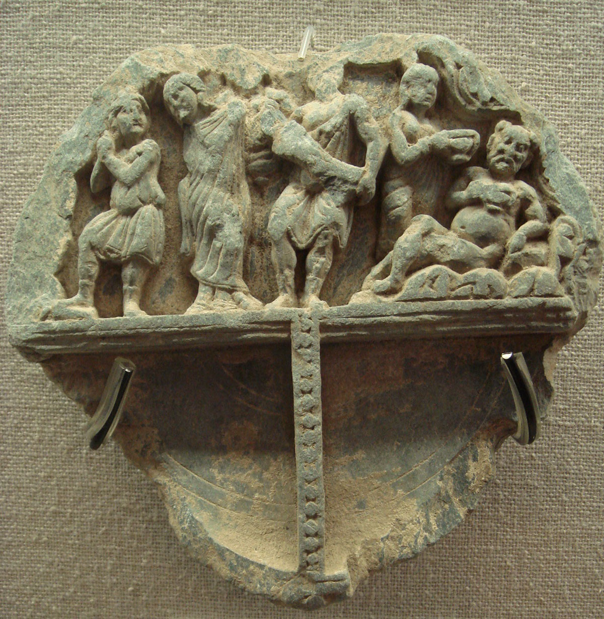 Indo-Greek banquet with Satyrs (Ancient Orient Museum, ID 81 in Database, https://en.wikipedia.org/wiki/File:IndoGreekFestivities.JPG) It’s from Wikipedia CC-BY 3.0