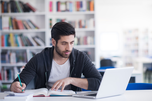 A man doing research online.