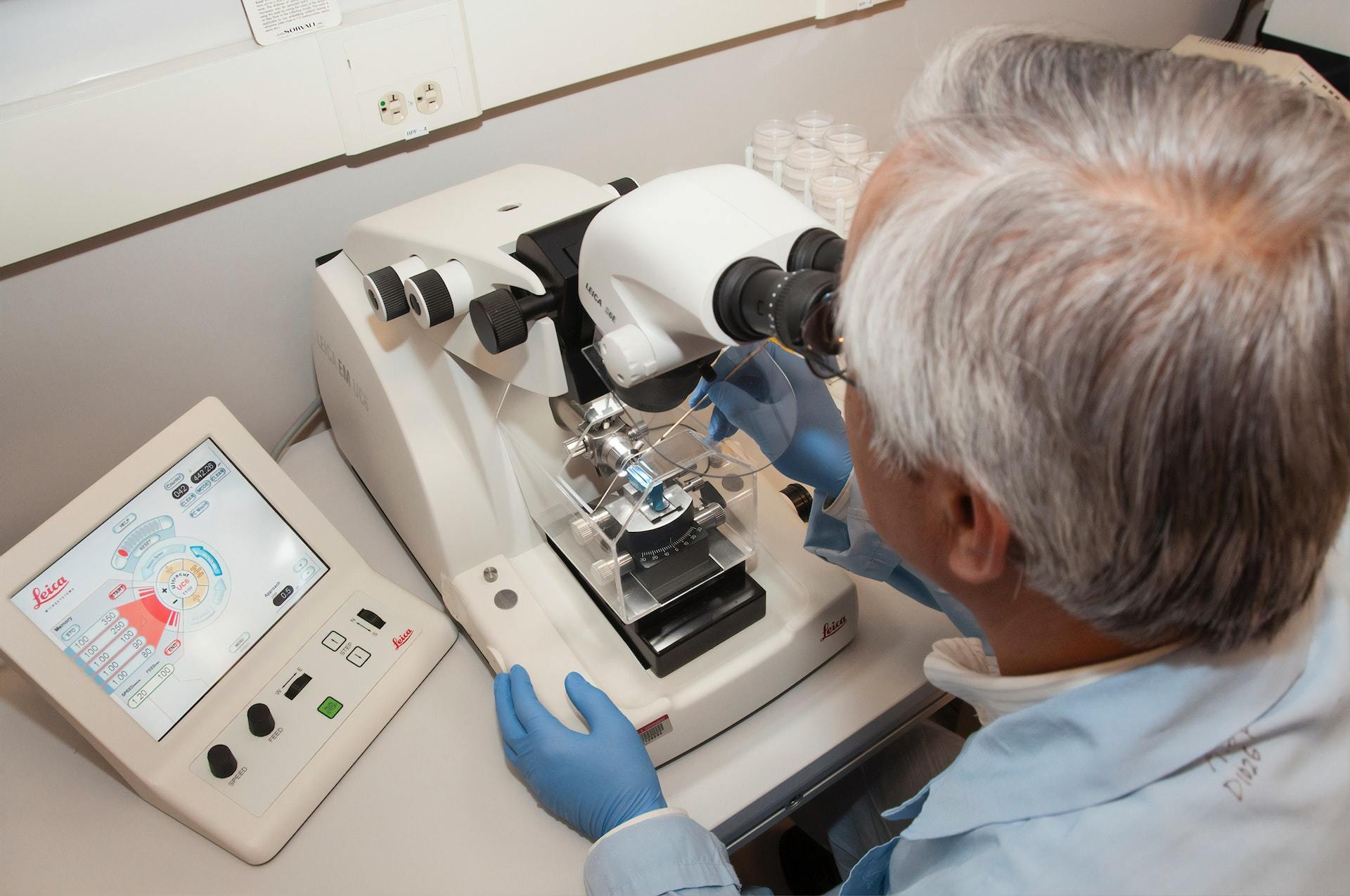 A technician using a microtome at the Advanced Technology Research Facility (ATRF), Frederick National Laboratory for Cancer Research, National Cancer Institute.