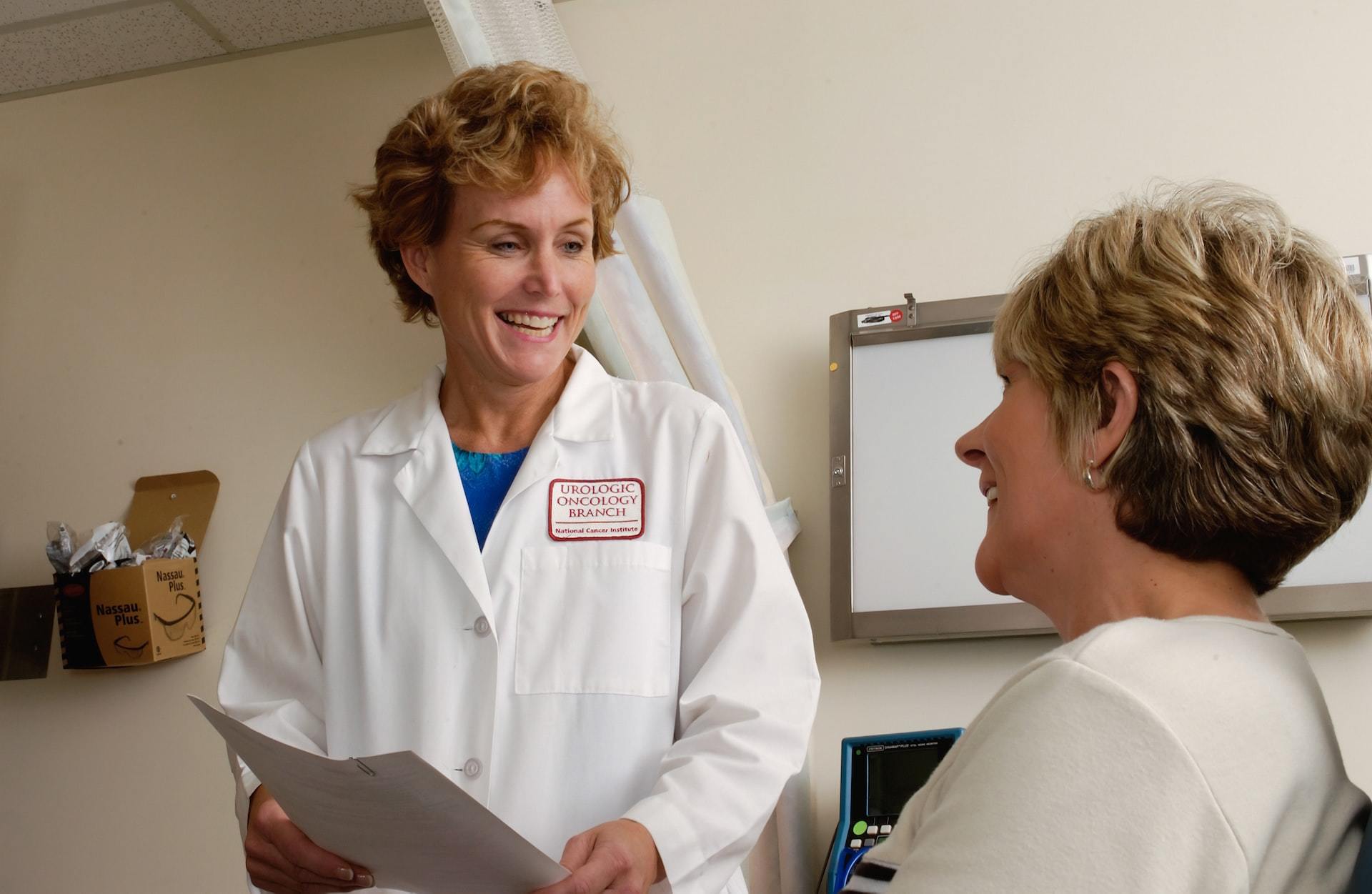 A woman meeting with a female doctor in a doctor's office.