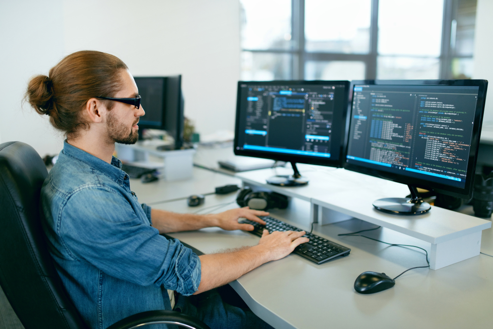 man-coding-at-computer