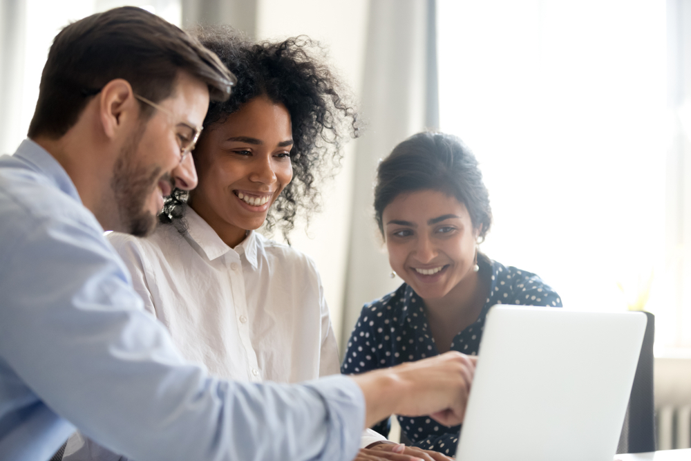 A manager teaching two interns.