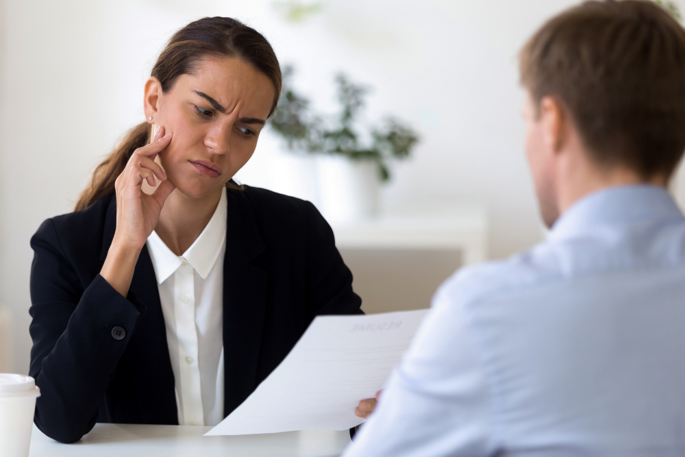 A hiring manager with a dubious expression on her face.