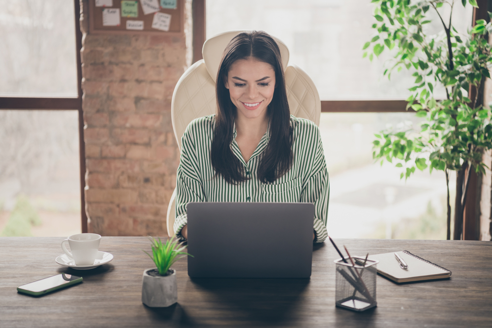 A PR director working on her laptop.