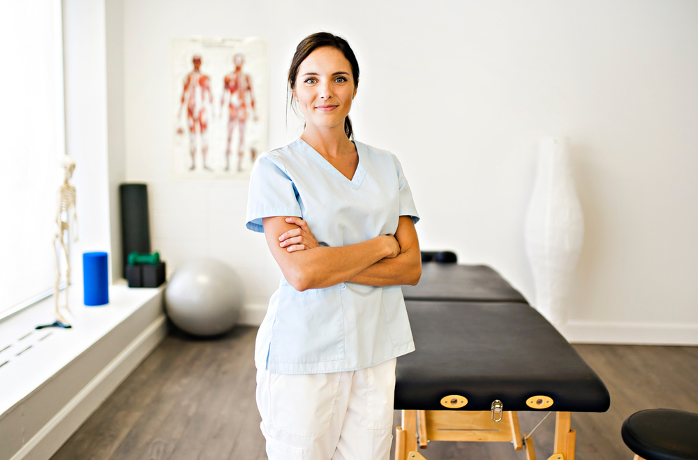 Physical therapist standing beside her tools.