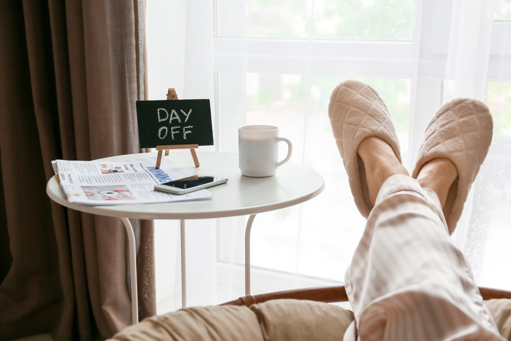 Woman in pajamas relaxing at home. Concept of a day off.