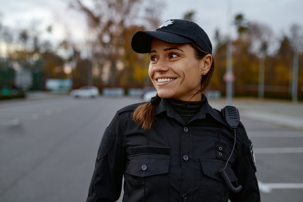 Smiling female security guard on the street.