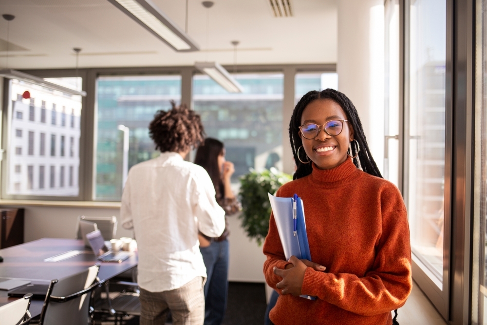 Young woman interning in an office.