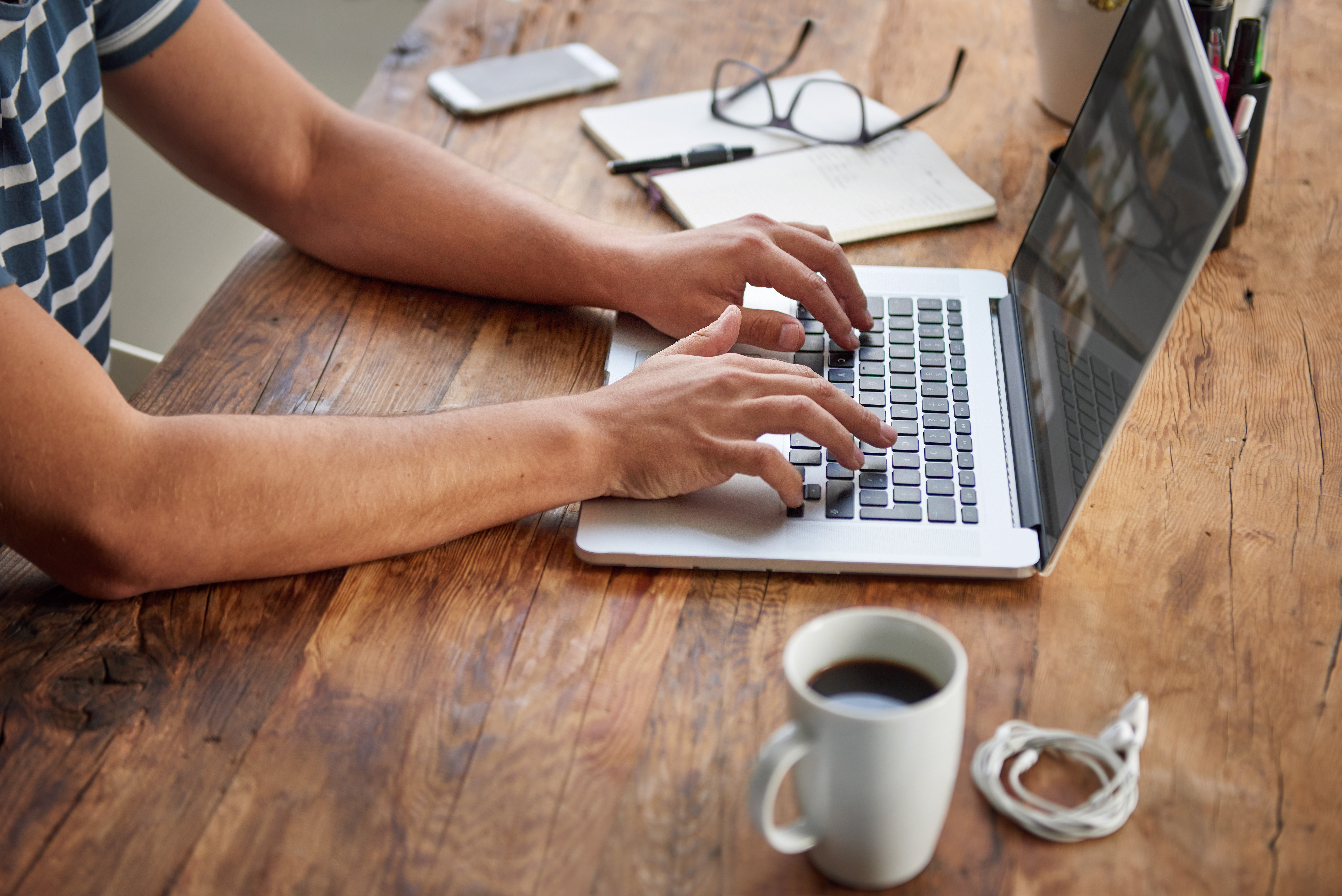 man-writing-at-table