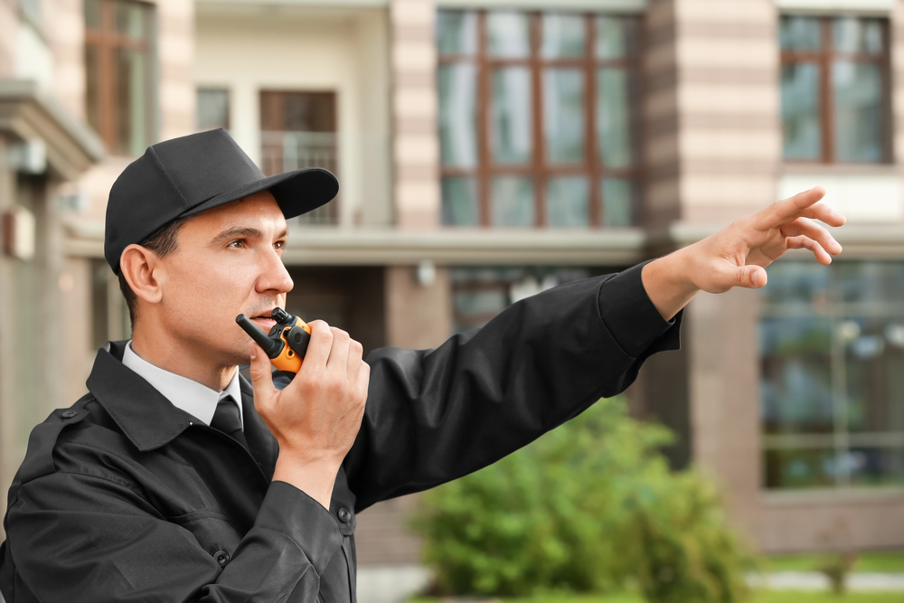 guard-communicating-on-walkie-talkie