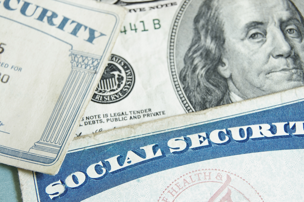 Social Security card and hundred dollar bill.