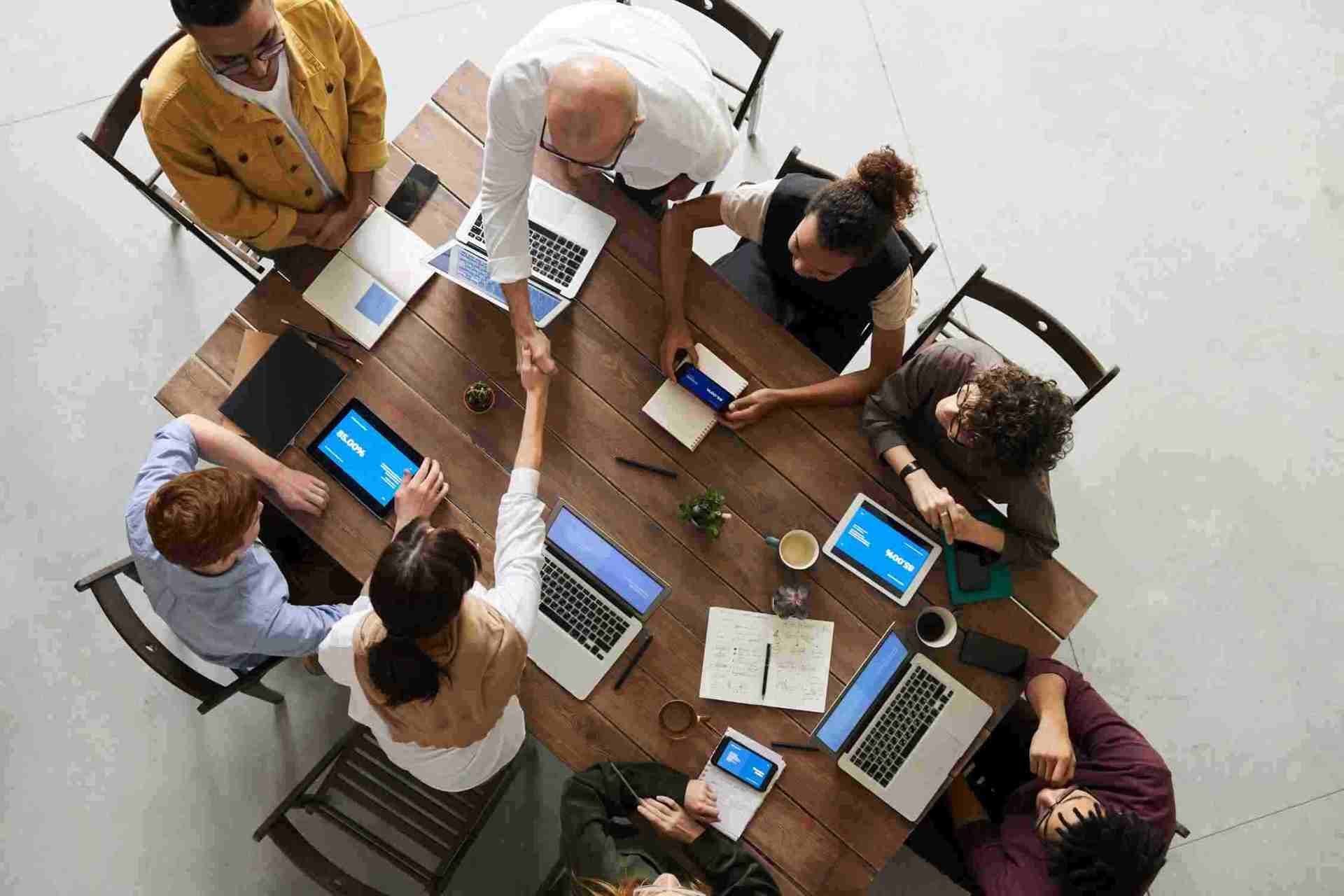 Employees all engaged in a meeting.