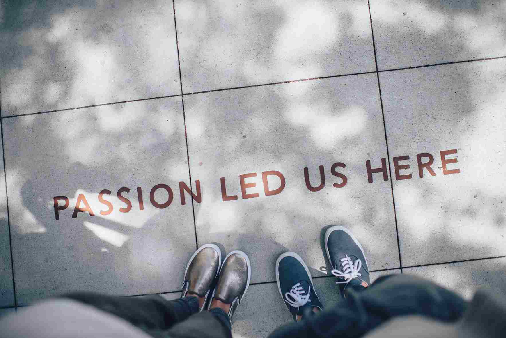Writing on tiles saying "passion led us here", a visualisation of employer branding - a key concept in talent attraction