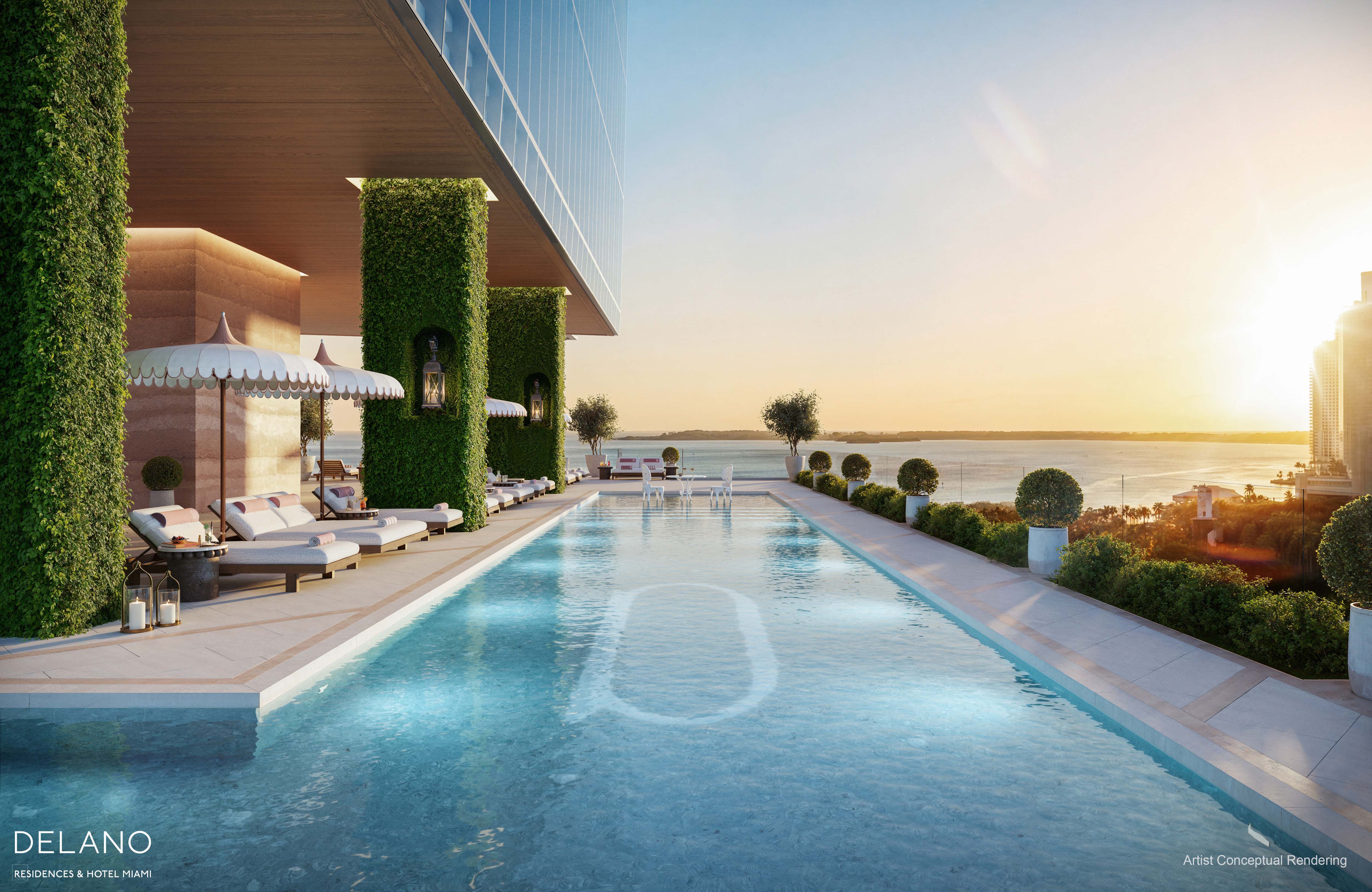 Wrap-around pool deck with cabanas overlooking Biscayne Bay at Delano Residences