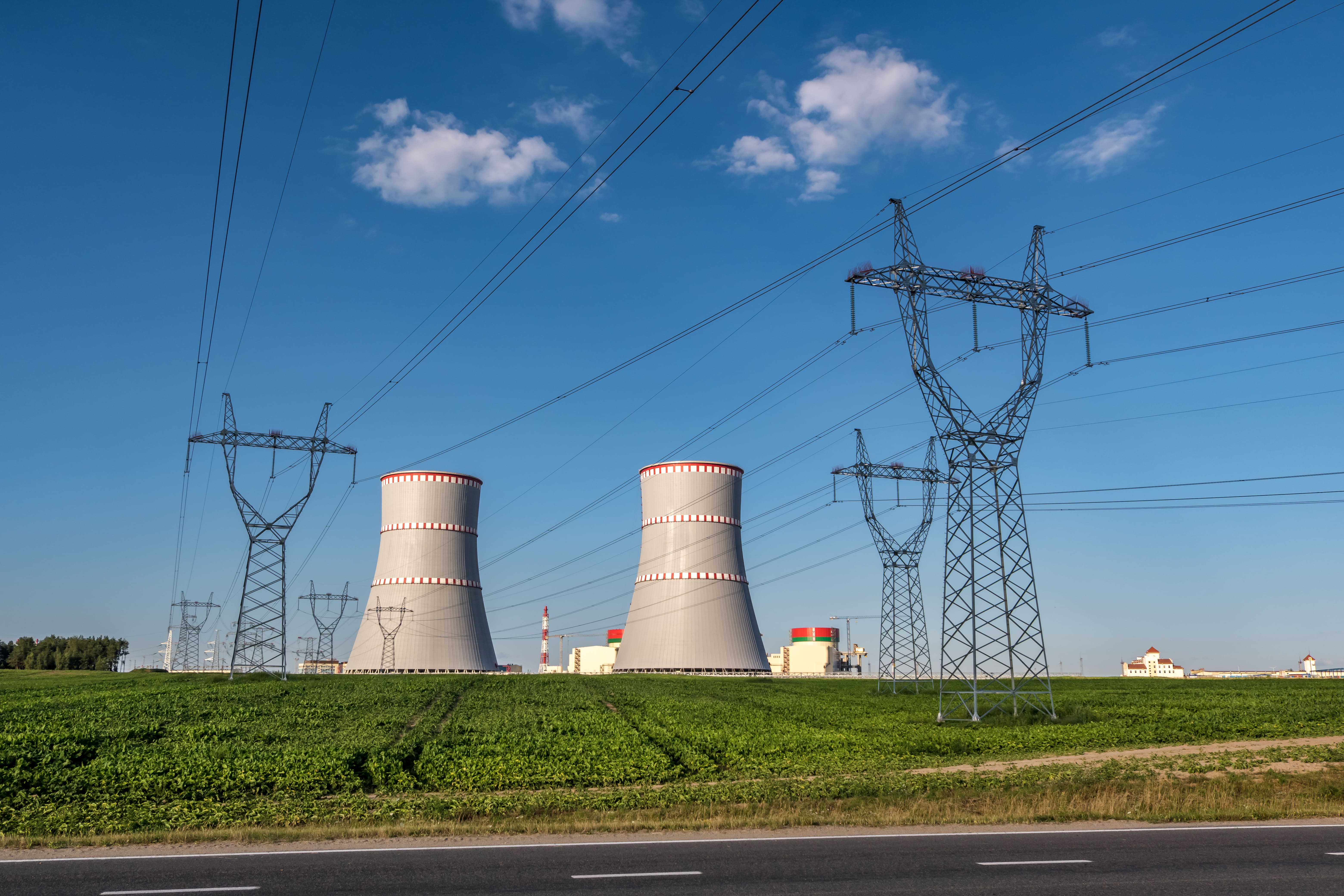 Ostrovec Belarus July 2020 Cooling Towers Nuclear Power Plant With High Voltage Electric Pylon Towers Against Blue Sky
