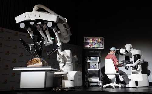 The surgeon operates the robot from a “cockpit” a short distance away from the patient. &nbsp; &nbsp; Source: Medicaroid<br>