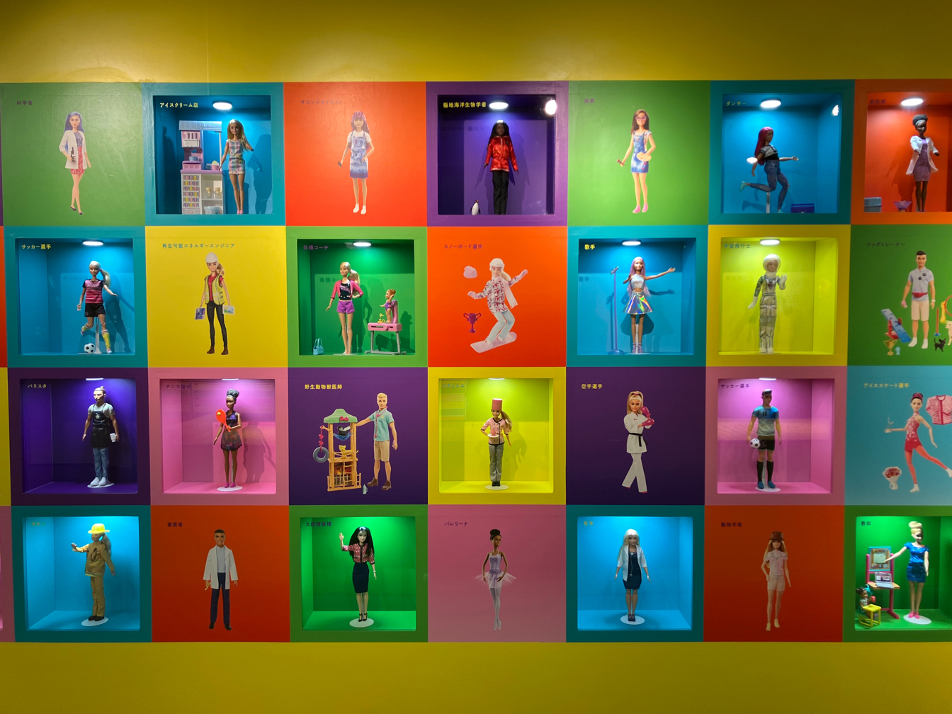 The barbie wall at the exhibition showcasing Barbie and Ken in different occupations.&nbsp; &nbsp; &nbsp;Source: J-STORIES