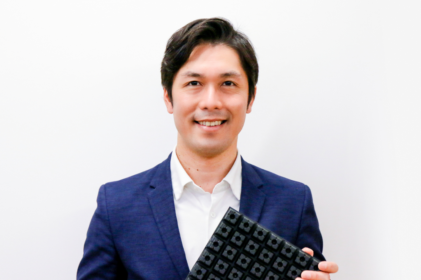 Magic Shields CEO Hiroshi Shimomura with a sheet of the start-up’s flooring material.&nbsp; &nbsp; &nbsp;Source: Magic Shields