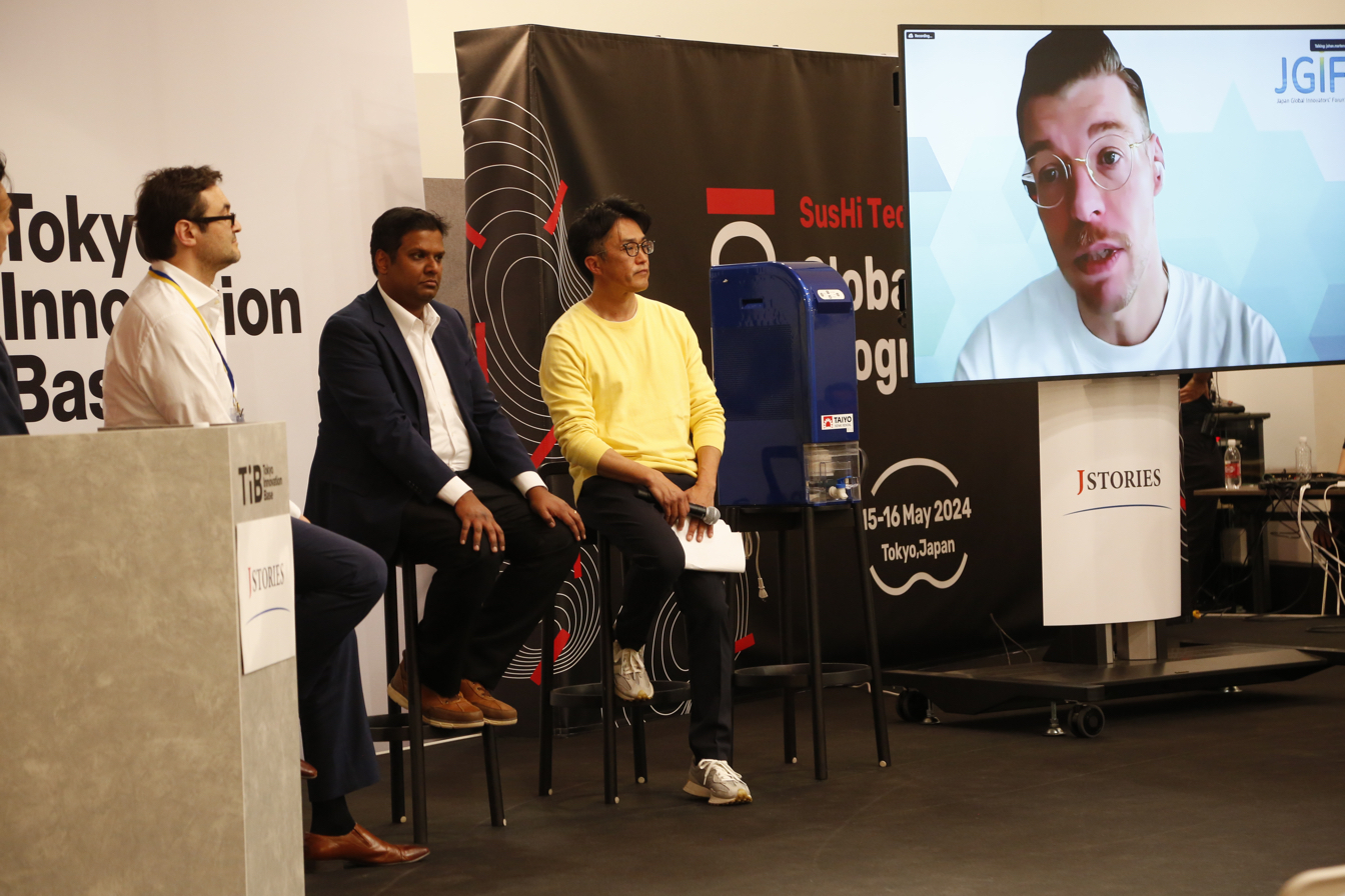 (From left) Shizen Capital Co-founder Matthew Romaine, Aster's Shanthanu and Ai Heart Japan's Motoki Hachisuka join the discussion in the Disaster Tech session as Johan Martens (on screen), innovation manager at Doctors Without Borders, shares his feedback from Holland.&nbsp;