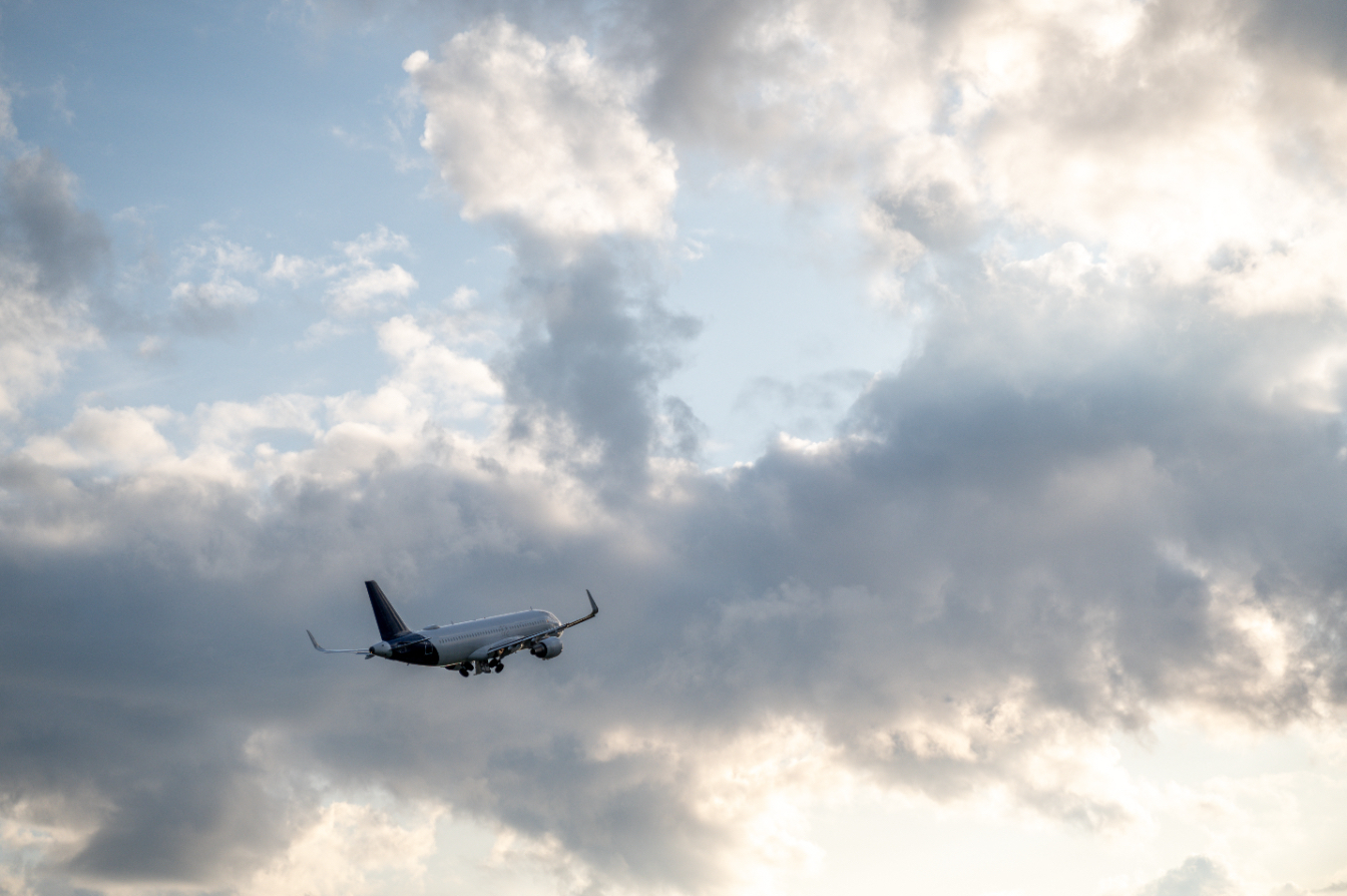 An image of an airplane flying through the clouds.&nbsp; &nbsp; &nbsp;Source: Envato