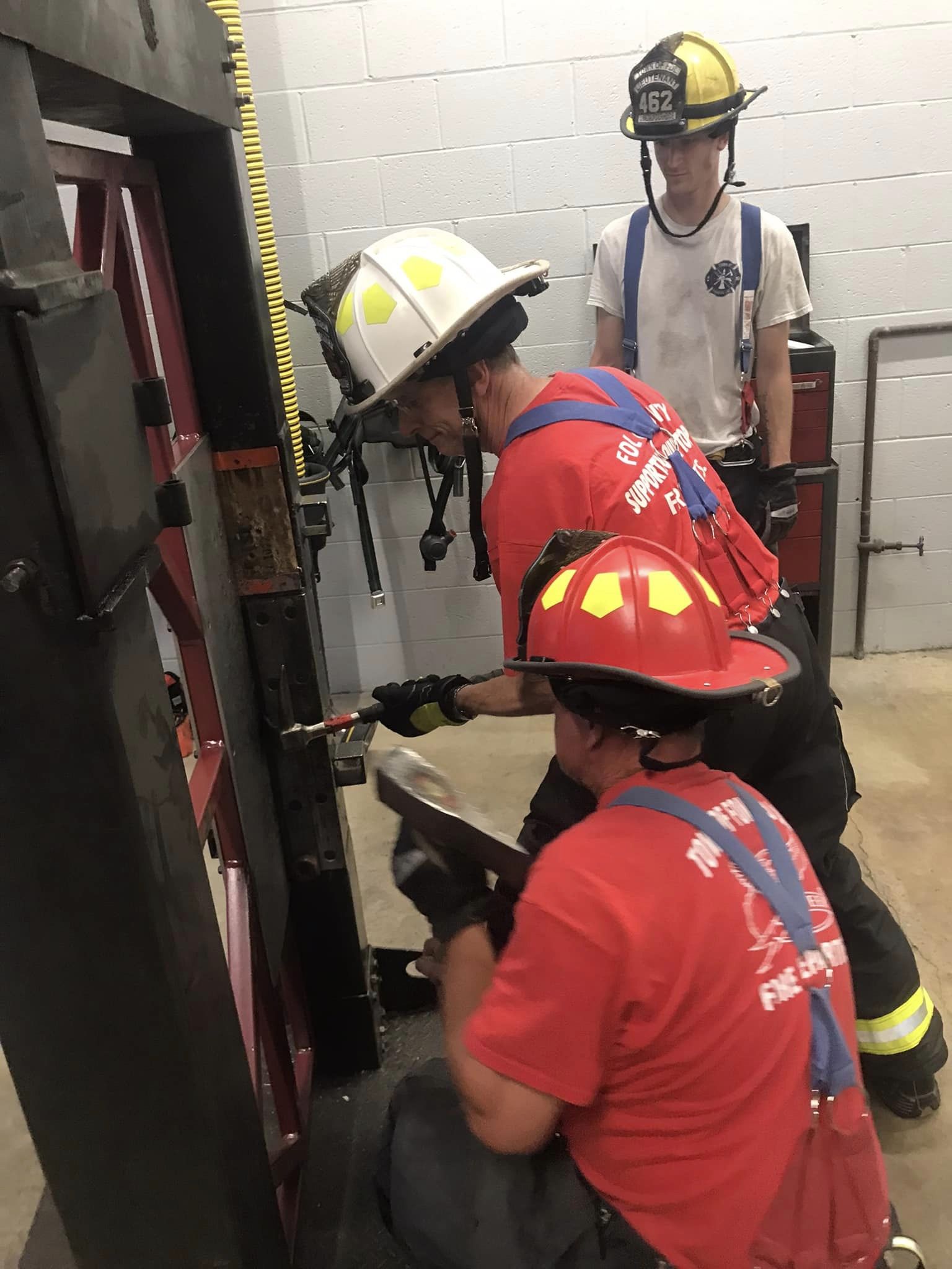 Firefighters coordinating during prop training