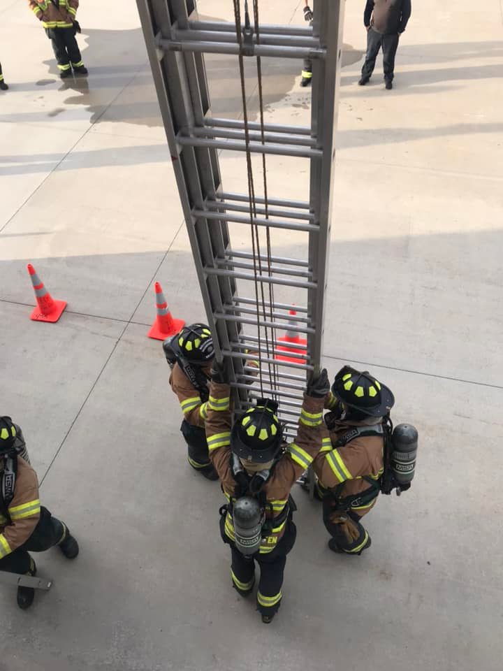 Team preparing ladder setup