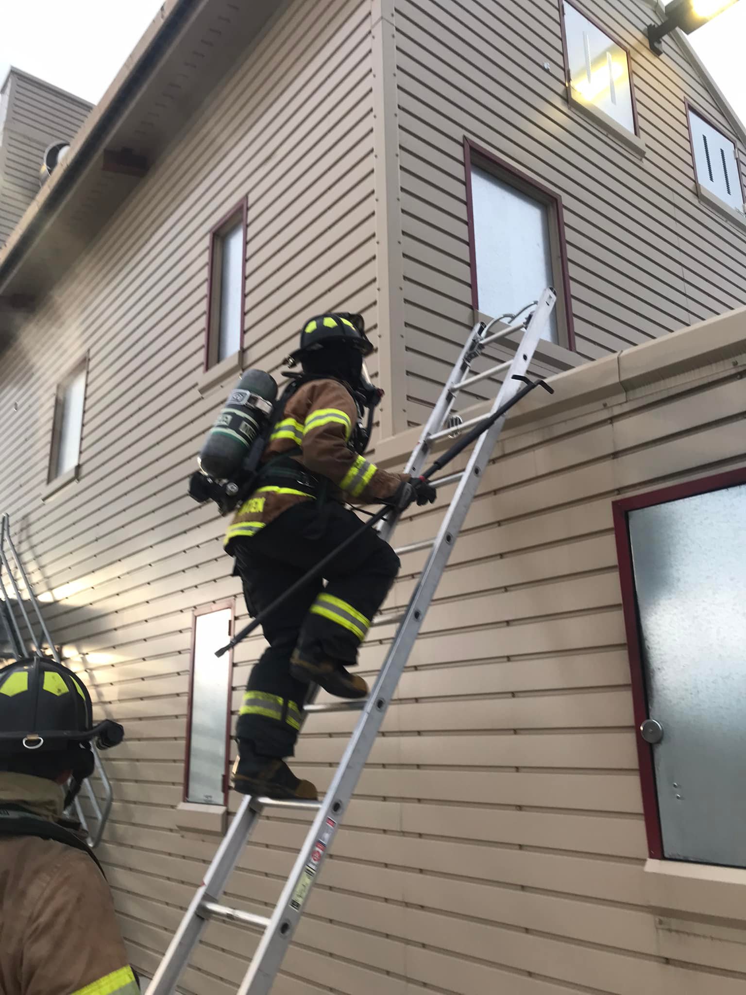 Firefighter using ladder access