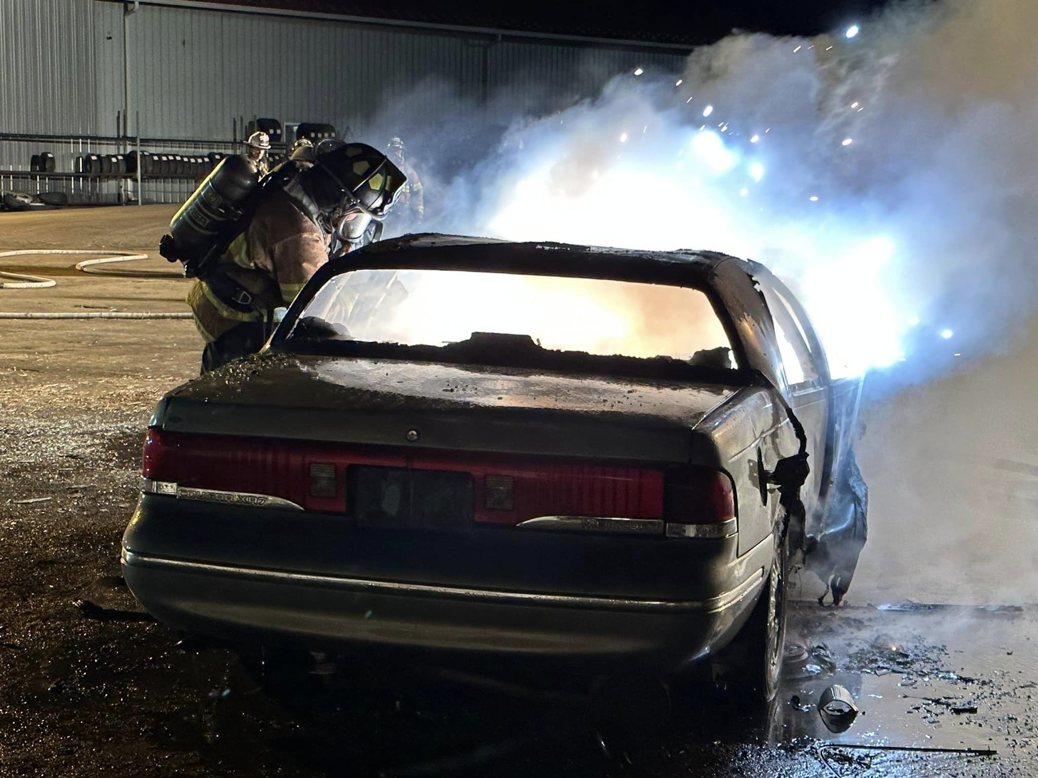 Flames spreading from trunk area