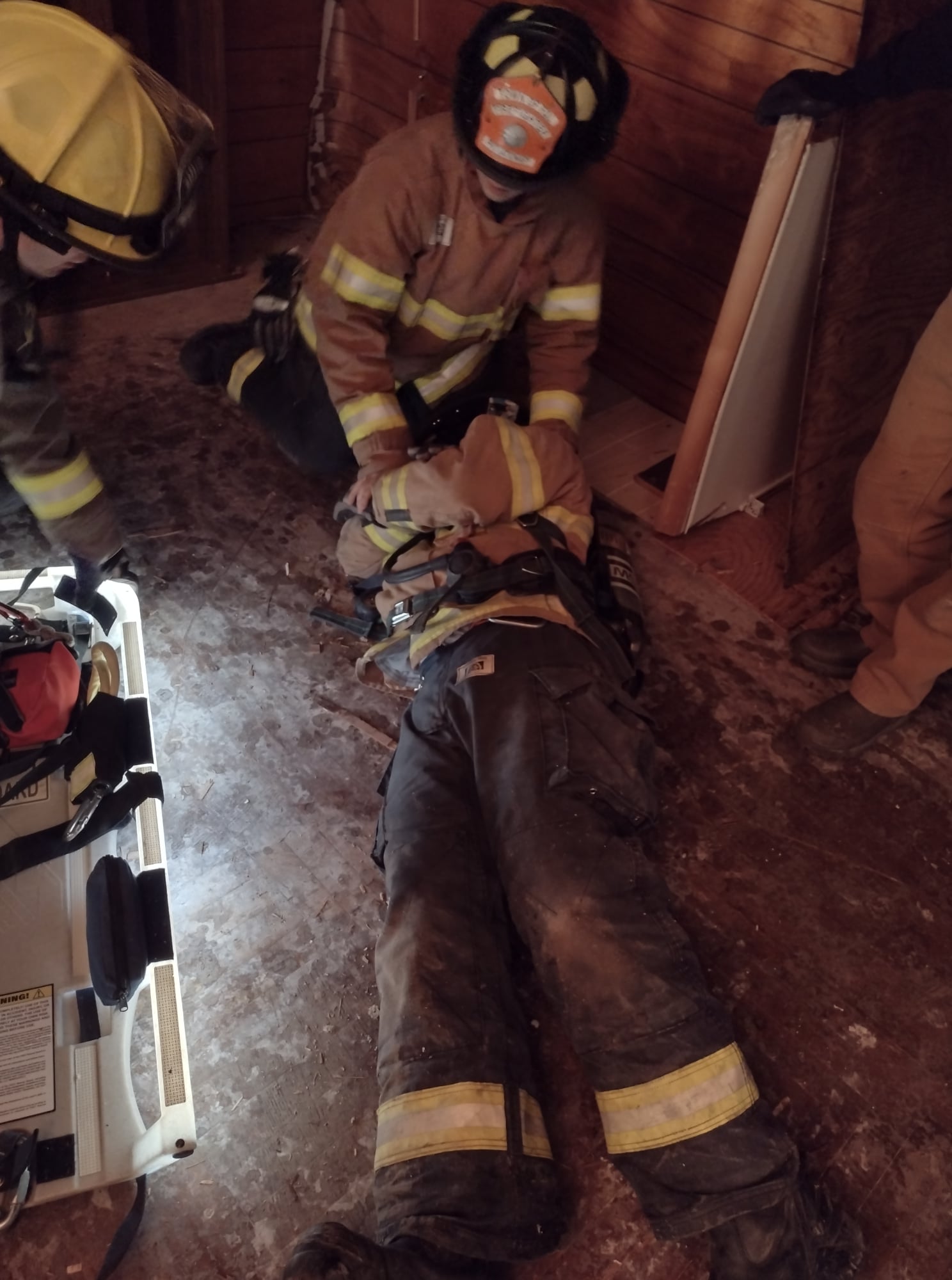 Firefighters practicing victim drag technique