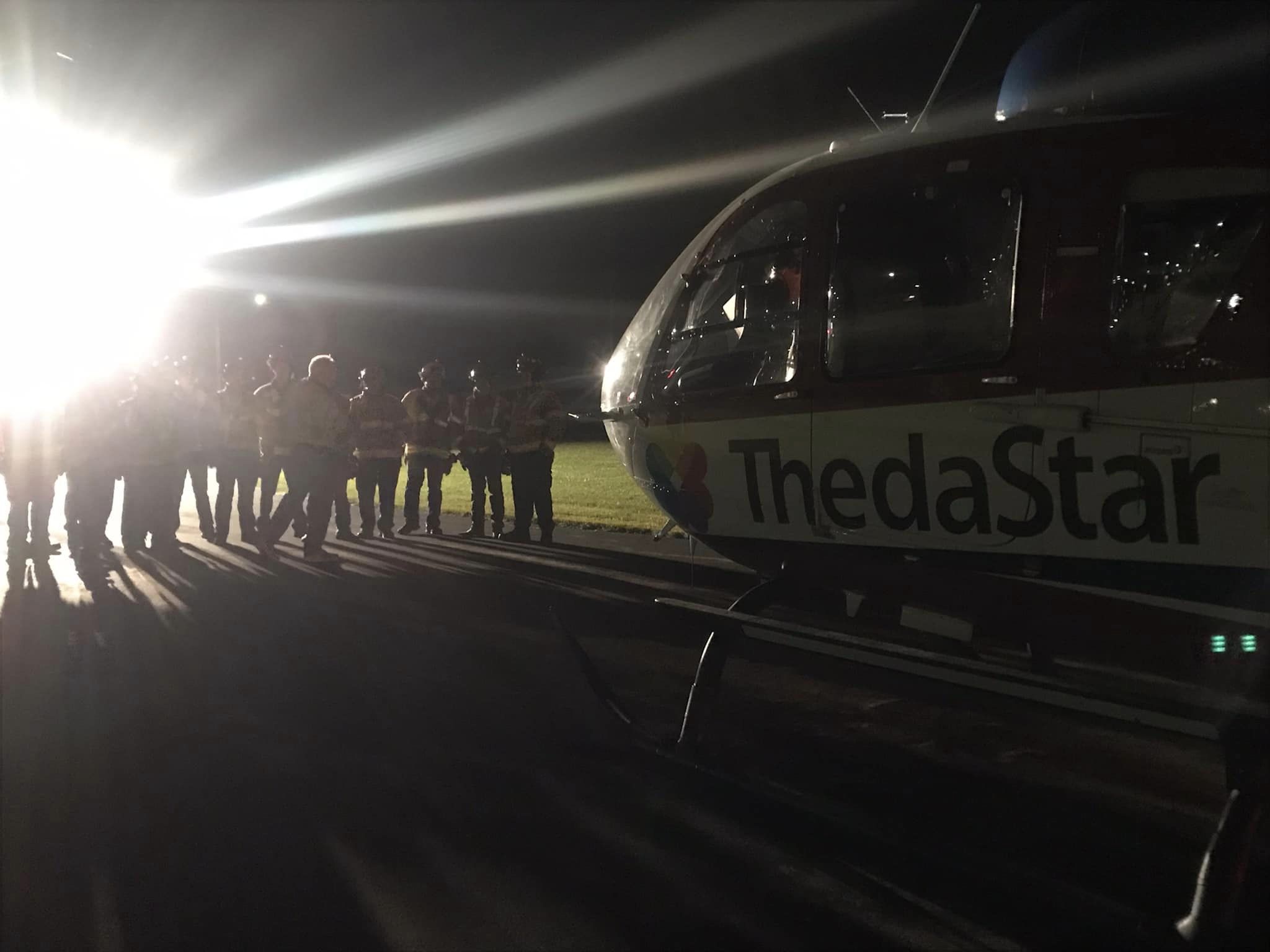 Helicopter with ground crews nearby